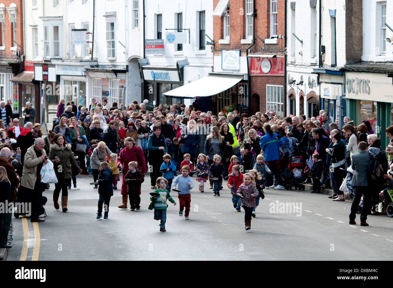 Children`s pancake race, Shrove Tuesday, Alcester, Warwickshire, UK Stock Photo